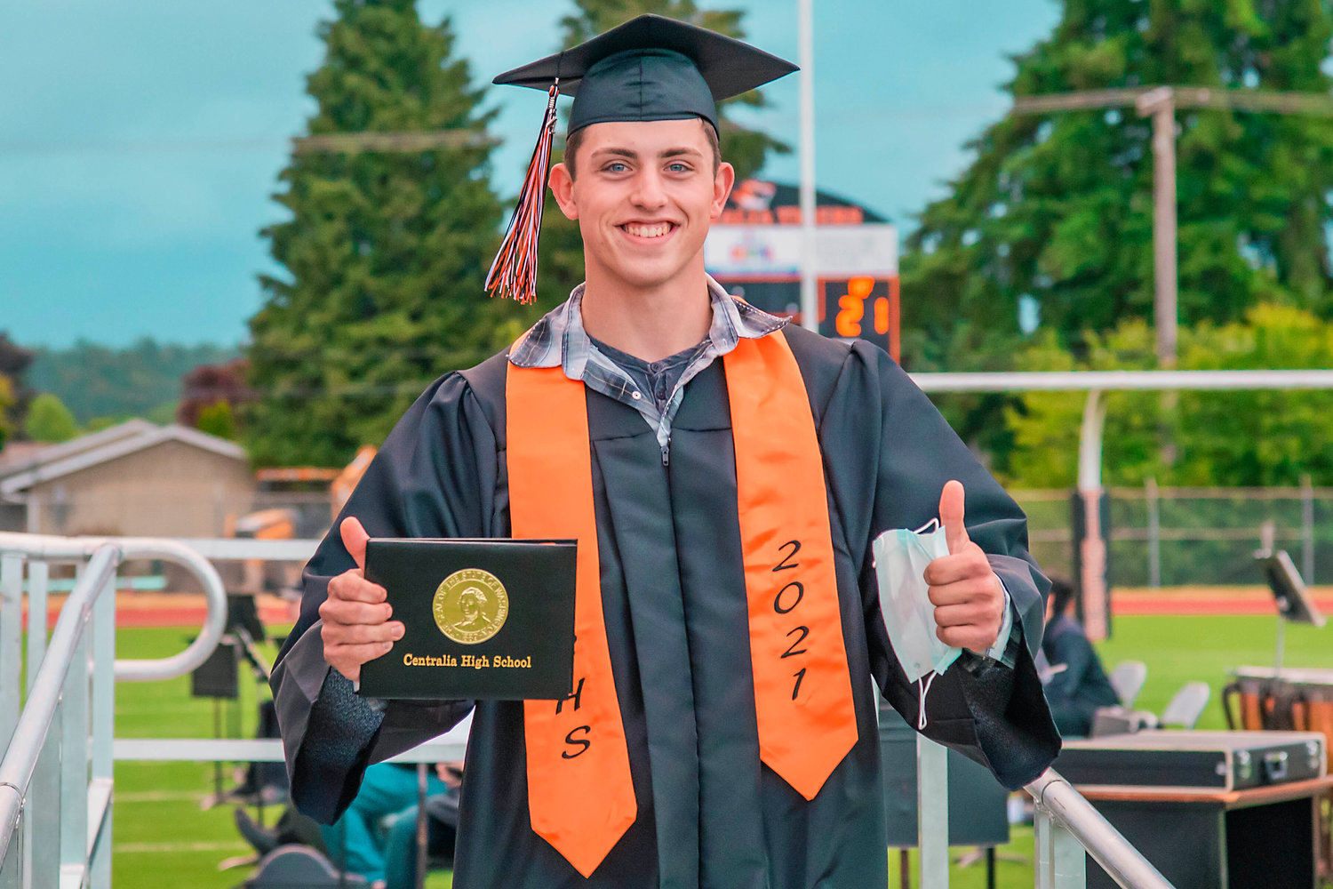 Sawyer Kassel gives thumbs up after receiving his diploma Friday night at Tiger Stadium.