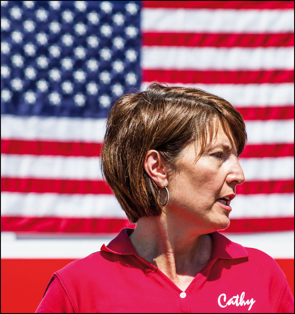 Rep. Cathy McMorris Rodgers stands in front of an American flag in this photo taken by Chewelah Independent editor Brandon Hansen.