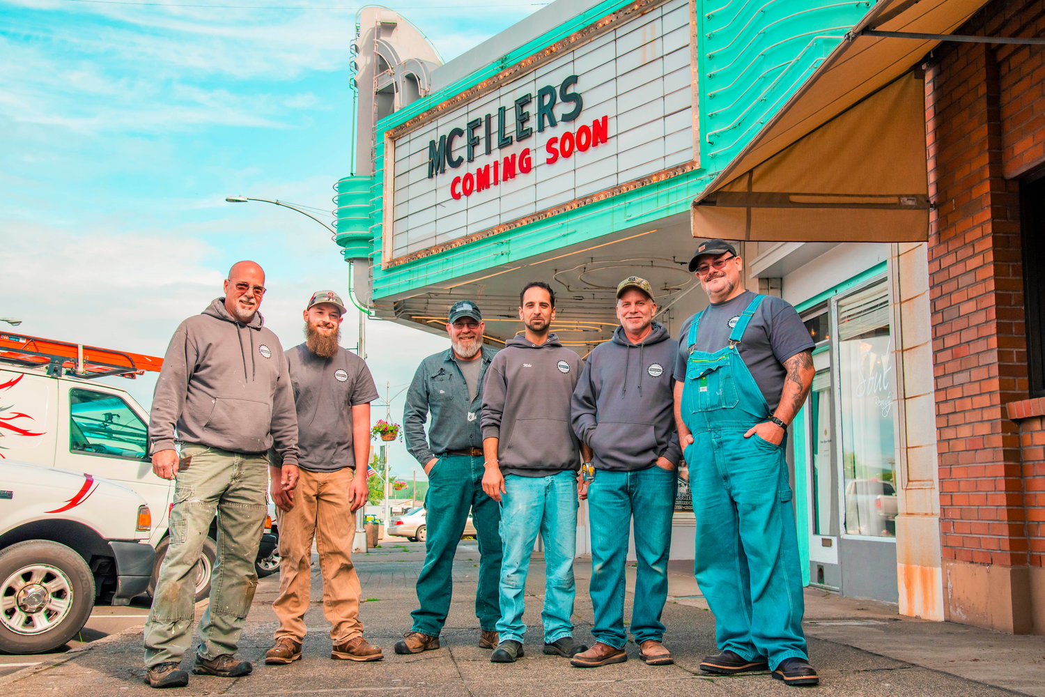 From left, Ron Winkleblack, Brenton Keefer, Rex Farrar, Mike DeMeo, Rick Johnson, and Paul Parker of Affordable Building and Maintenance Inc. smile and pose for photo outside the Chehalis Theater on Tuesday.