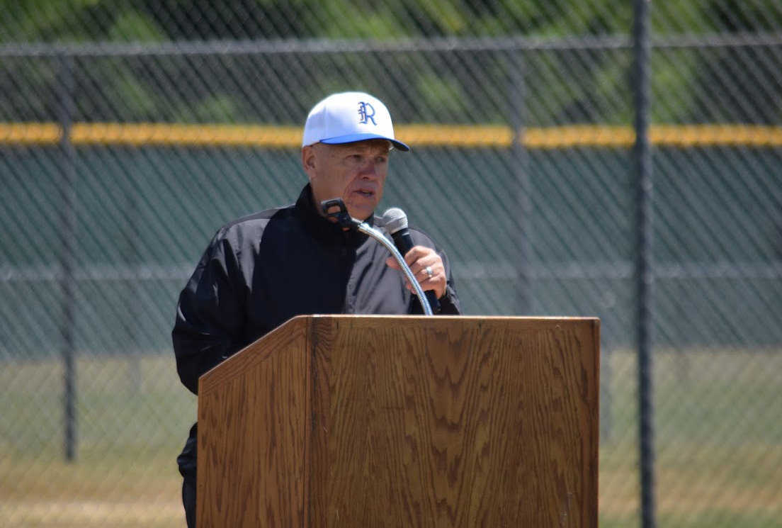 Former Rochester baseball coach Larry Heinz, who was Justin Rotter's teacher, coach and colleague, talks during a field rededication ceremony  to renamen the field Heinz-Rotter Field on June 5.