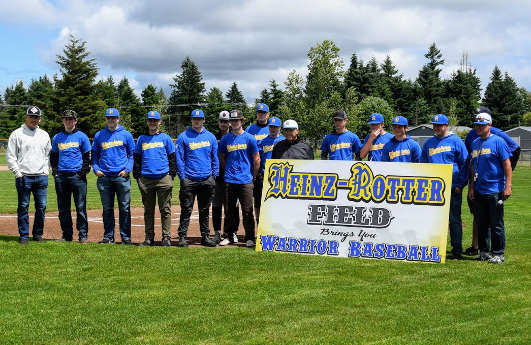 The Rochester baseball team stands in front of the new Heinz-Rotter Field sign during a ceremony on June 5, 2021.
