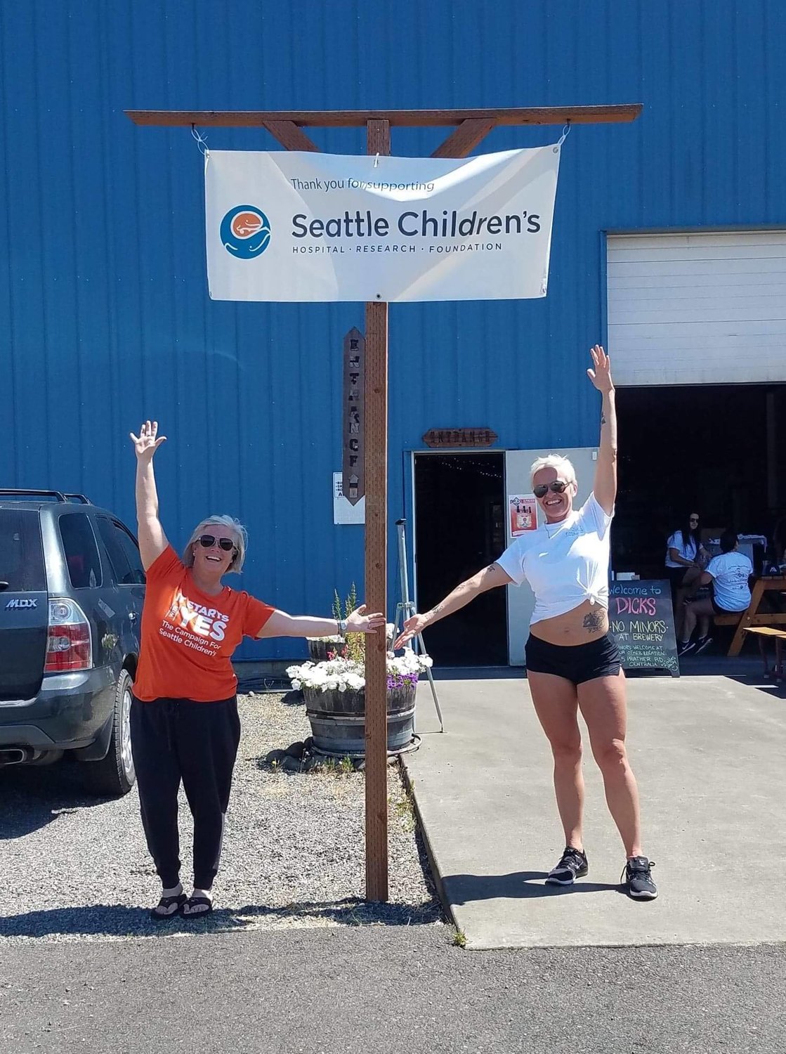 A pair of Adaline Coffman Guild members show their support for Seattle Children’s Hospital during a fundraiser.