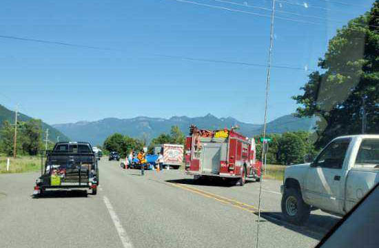 Emergency responders and fellow motorists stop to assist after a crash on U.S. Highway 12 near Randle Friday.