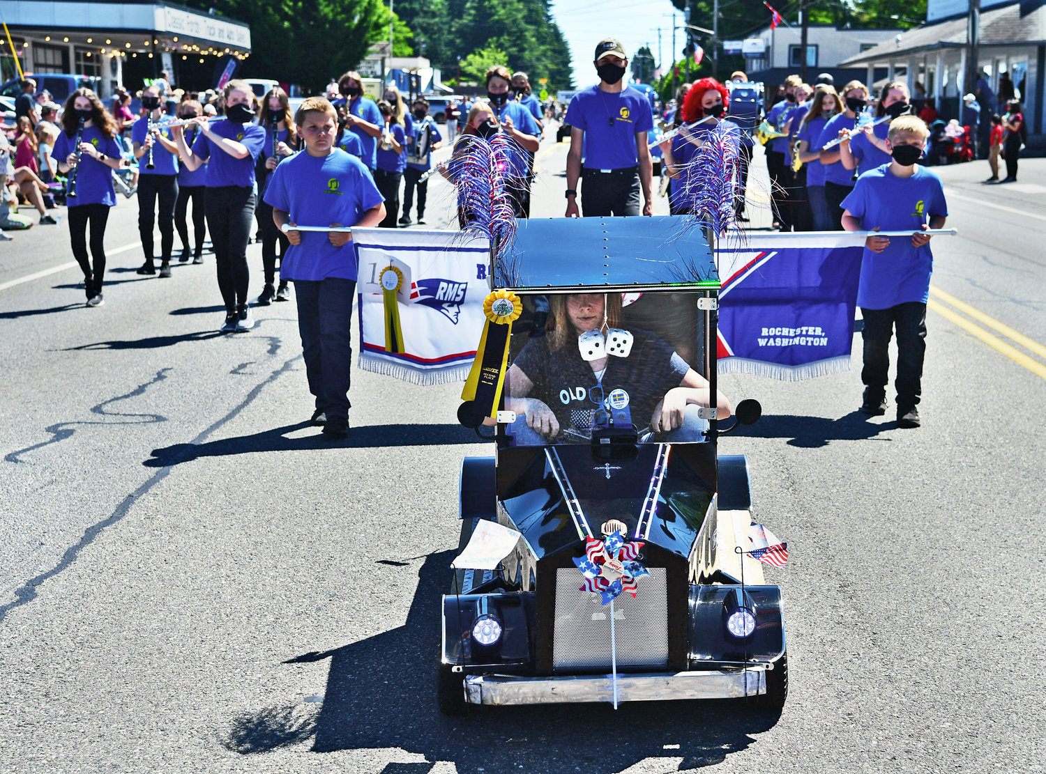 Representing Rochester Middle School, a marching band led by a cute, miniature car joins the Swede Day parade on Satuday, June 19.