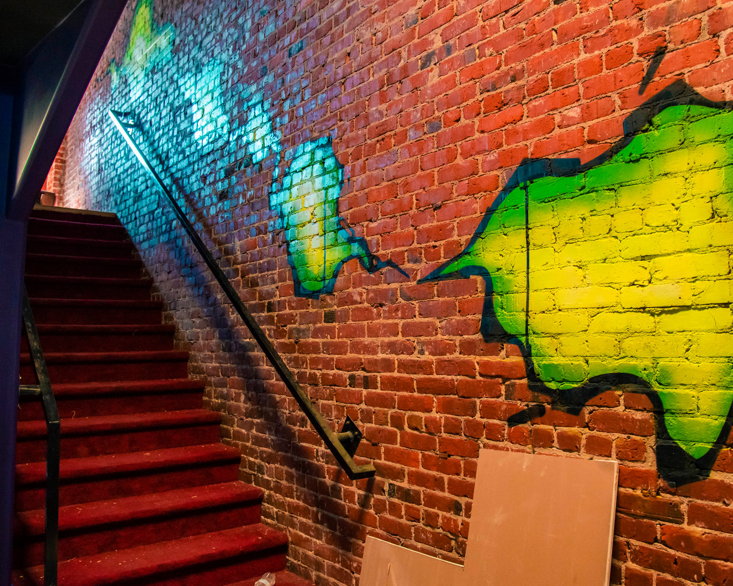 A mural leads up a staircase at Insert Coin in Centralia as construction continues on the arcade bar Thursday.