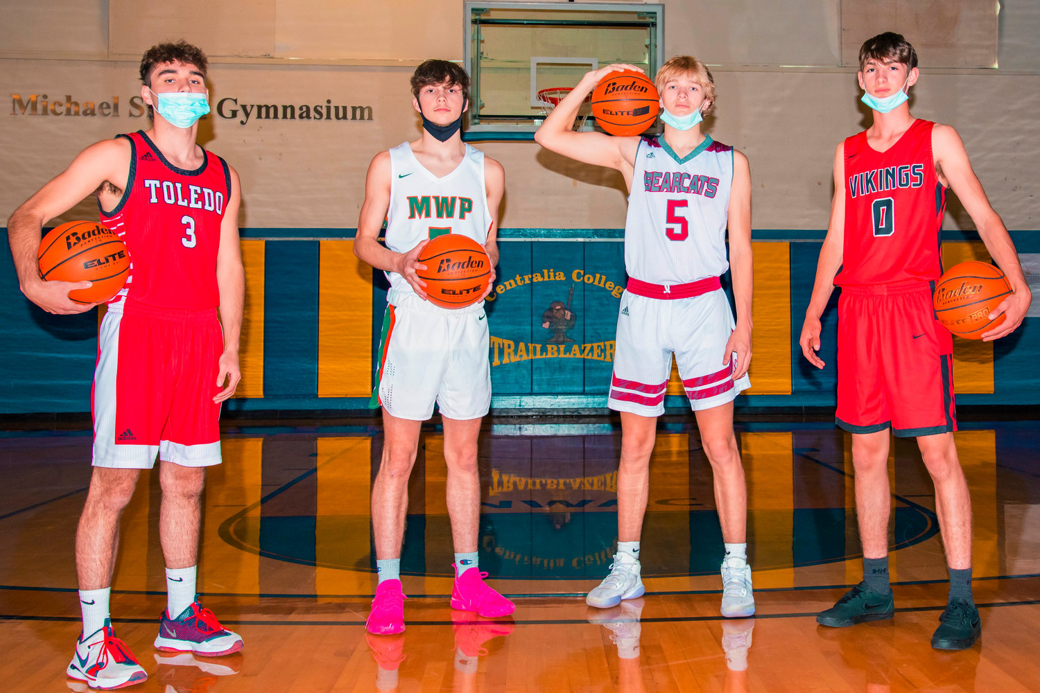 Four of the seven members of The Chronicle's 2021 All-Area Boys Basketball Team pose for a photo. From left, Toledo's Carlo Arceo-Hansen, Morton-White Pass's Tyler Blake, W.F. West's Dirk Plakinger and Mossyrock's Gunner Mulligan.