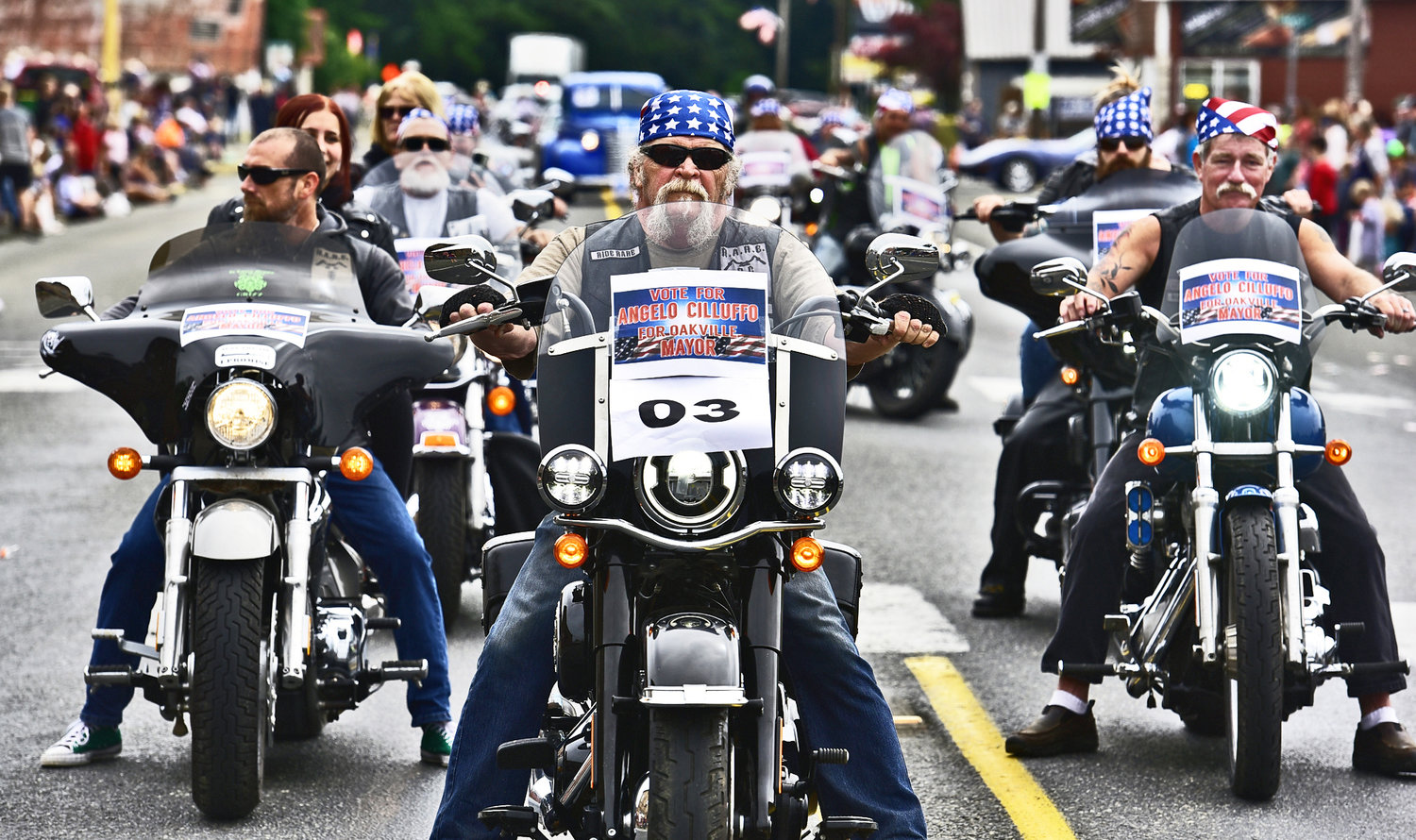 Oakville Mayor Angelo Cilluffo, leads a group of motorcycle riders as they participate in Oakville’s Independence Day parade on Saturday, July 3. The club, called Real American Riding Enthusiasts (RARE), does a lot of charity work, Cilluffo said.