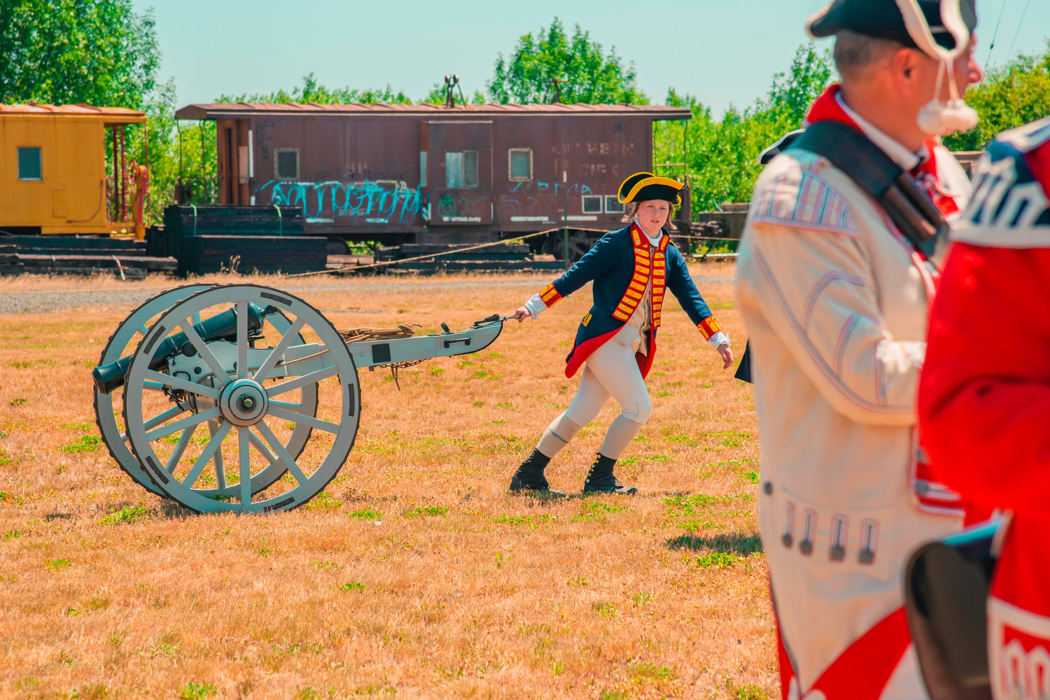 A cannon is carried into a field by the Veterans Memorial Museum during an American Revolutionary War reenactment in Chehalis Saturday afternoon as part of 1776 Day celebrations.