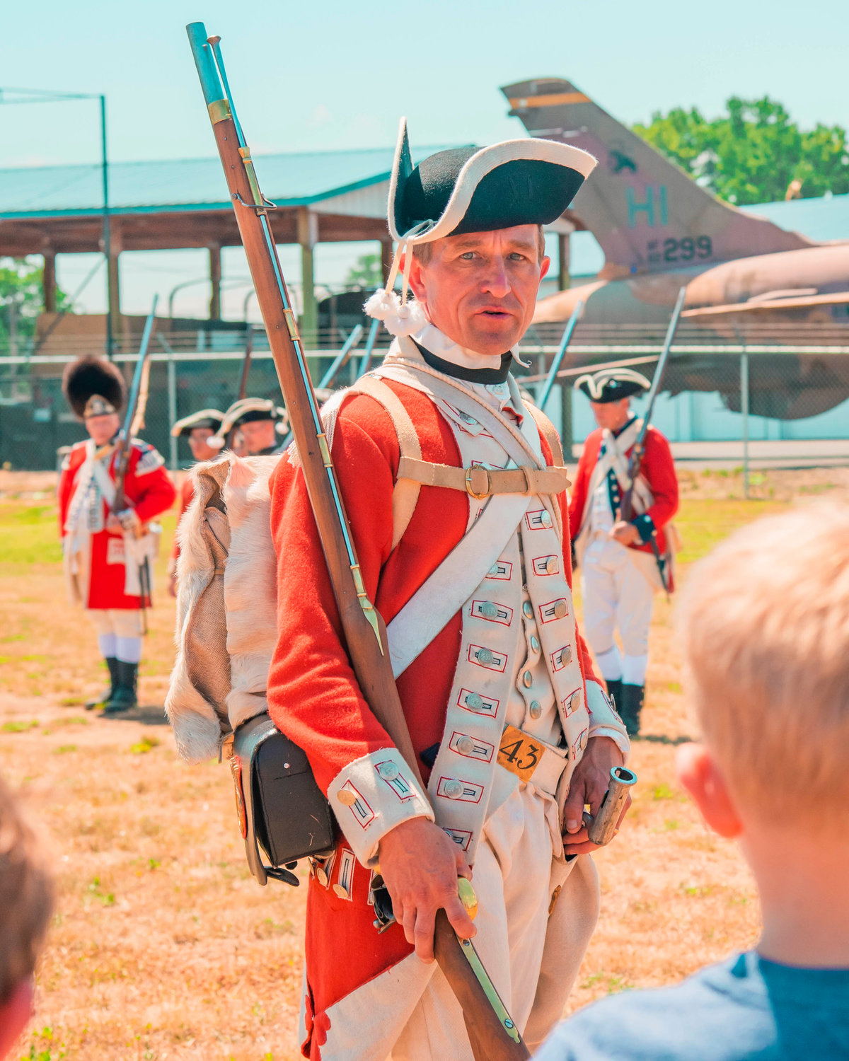 Andy House-Higgins, dressed for the part of Corporal Thomas Gosling of the 43rd Regiment, provides historical facts and information during an American Revolutionary War reenactment at the Veterans Memorial Museum in Chehalis on Saturday.