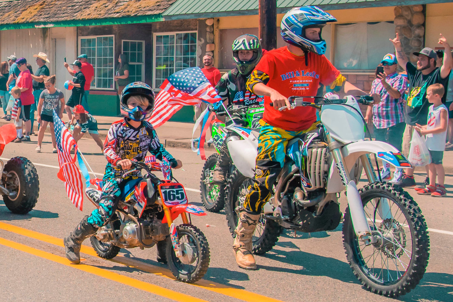 Dirtbikes and quads rev up in downtown Pe Ell for Fourth of July on Sunday.