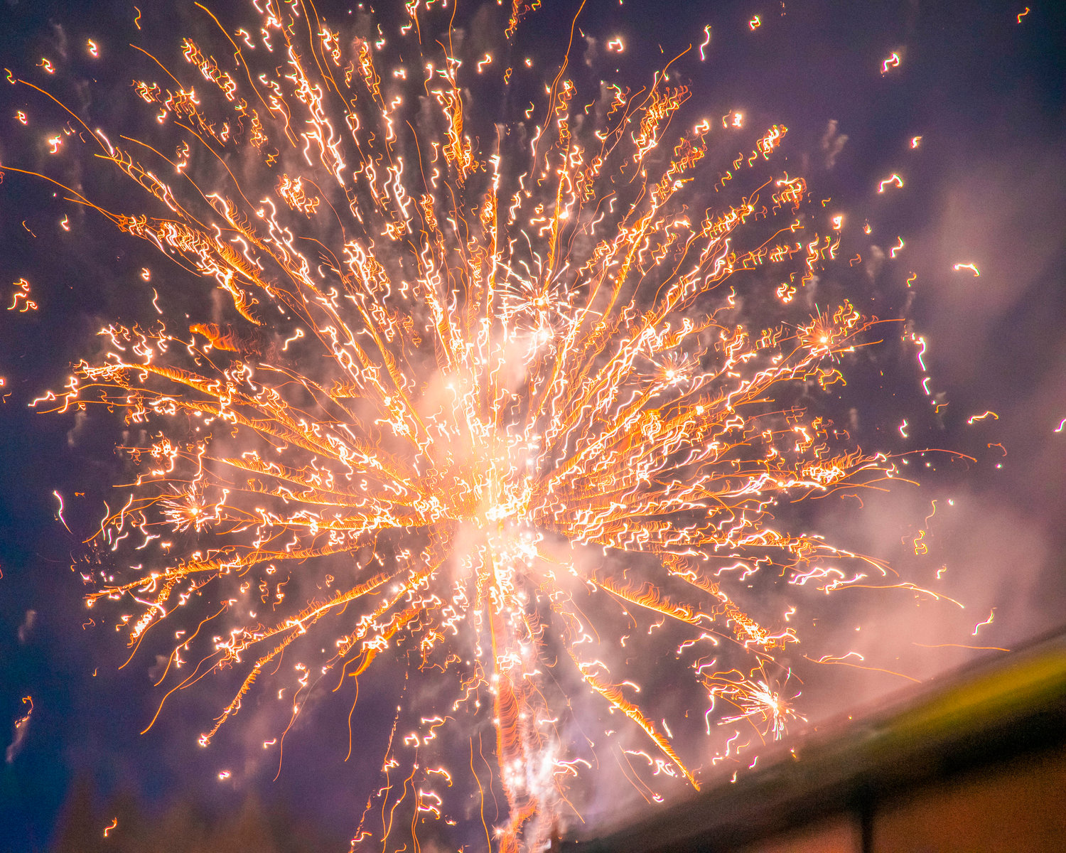 Fireworks explode over the Pe Ell School during Fourth of July celebrations Sunday night.