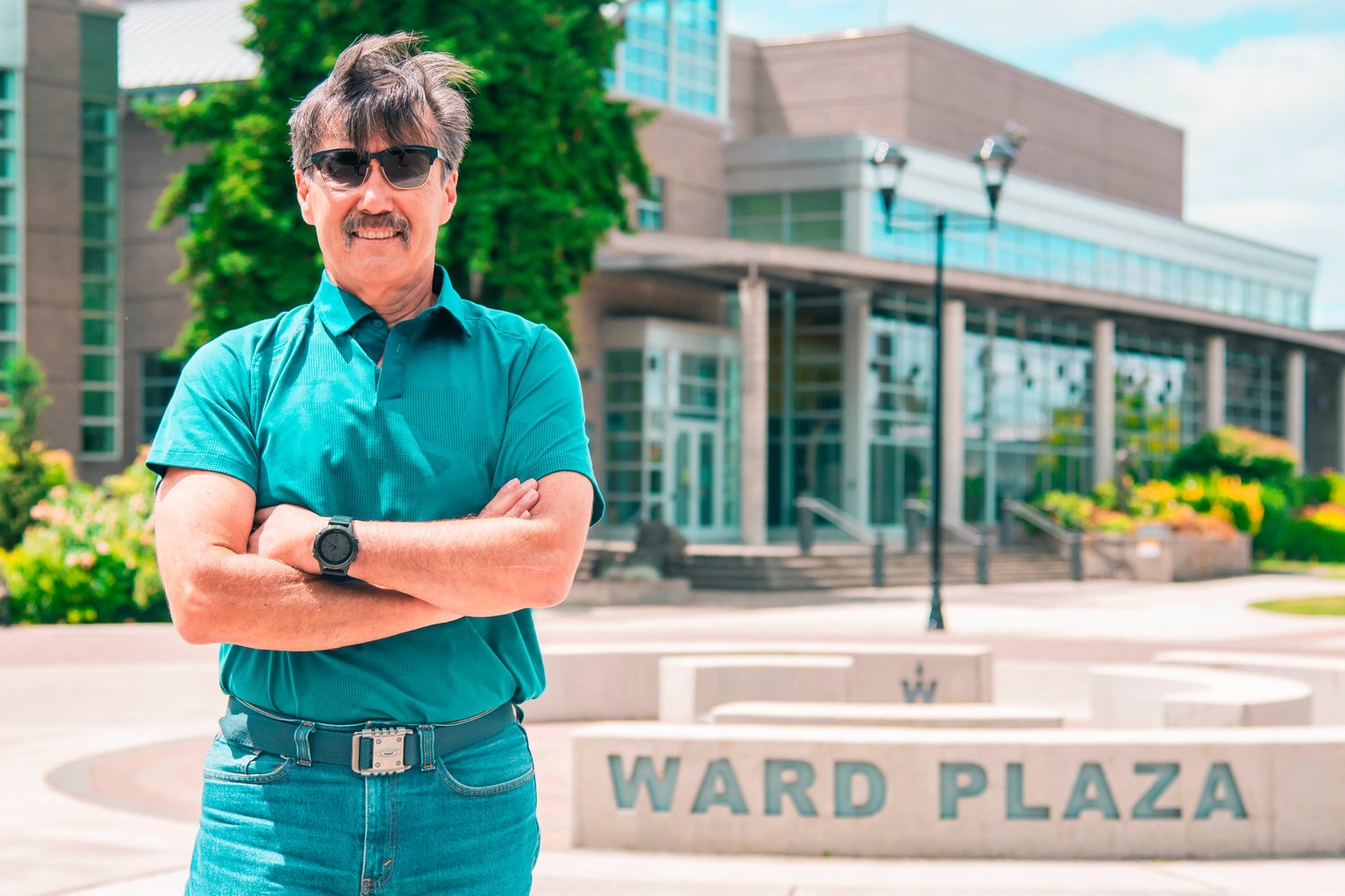 Steve Ward poses for a photo Wednesday afternoon in the center of the Centralia College campus aptly named Ward Plaza.
