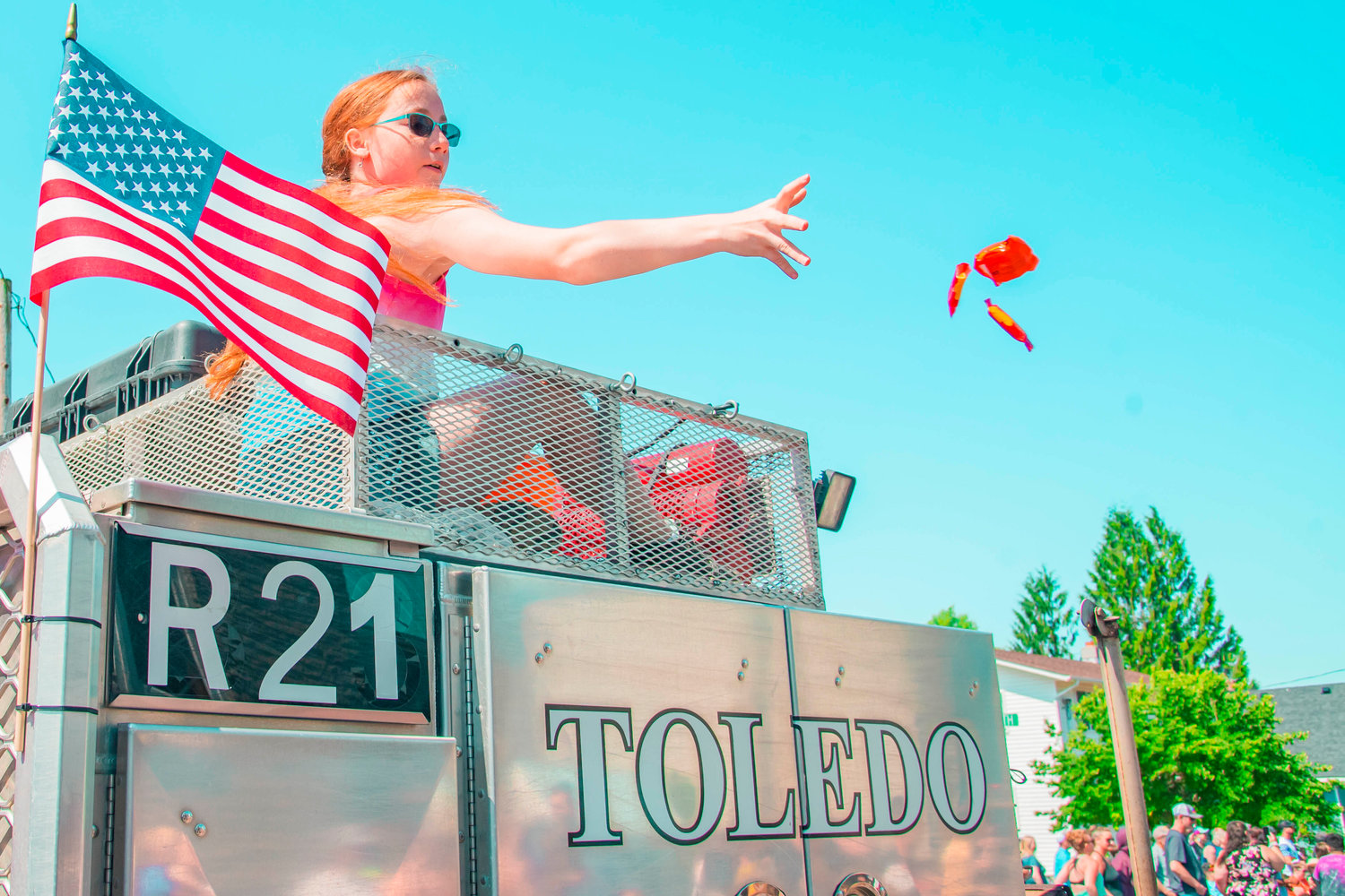 Candy is thrown from a Toledo Fire apparatus during the Toledo Cheese Days Parade on Saturday.