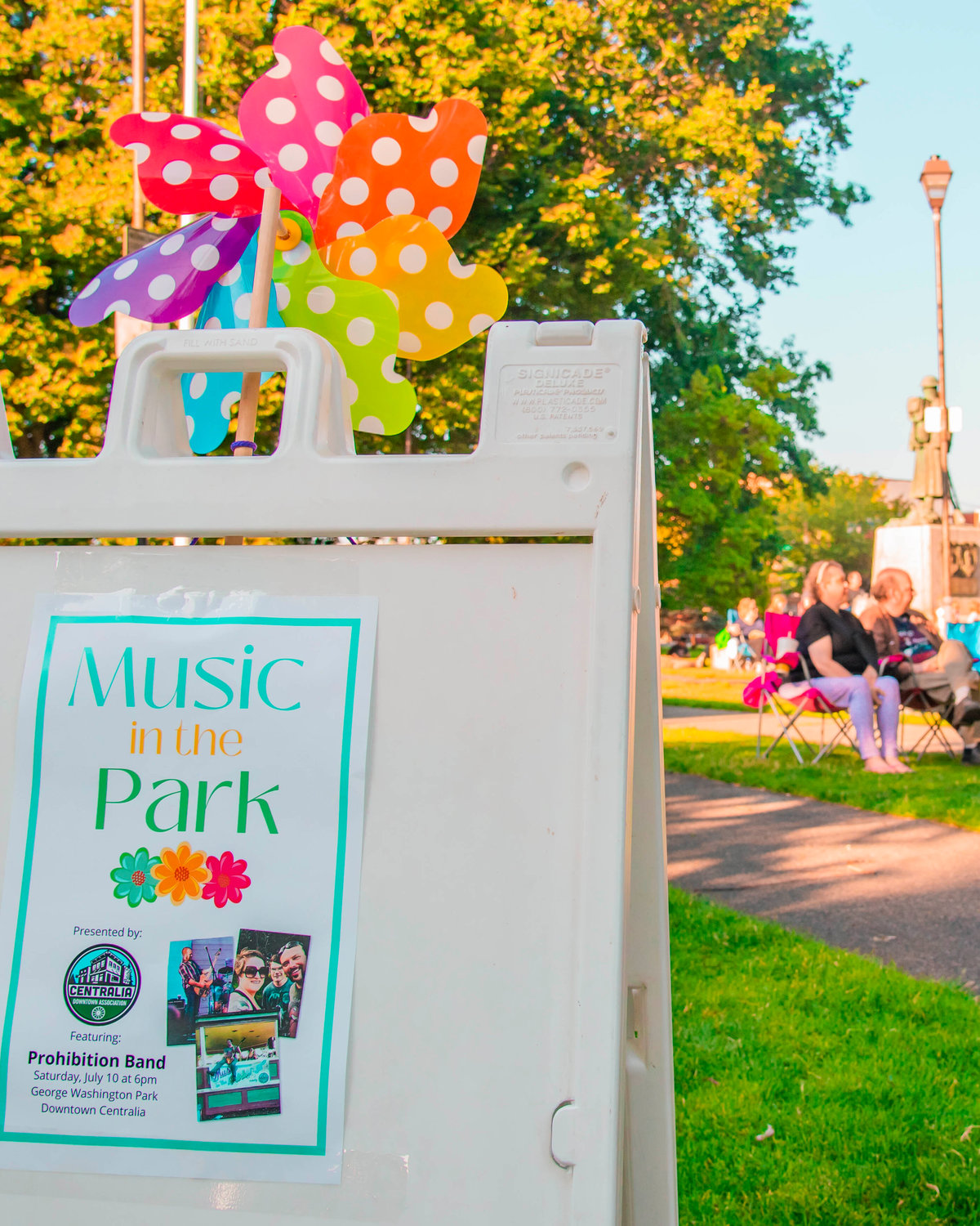 Signage for “Music in the Park” presented by the Centralia Downtown Association is on display Saturday in George Washington Park during an event.