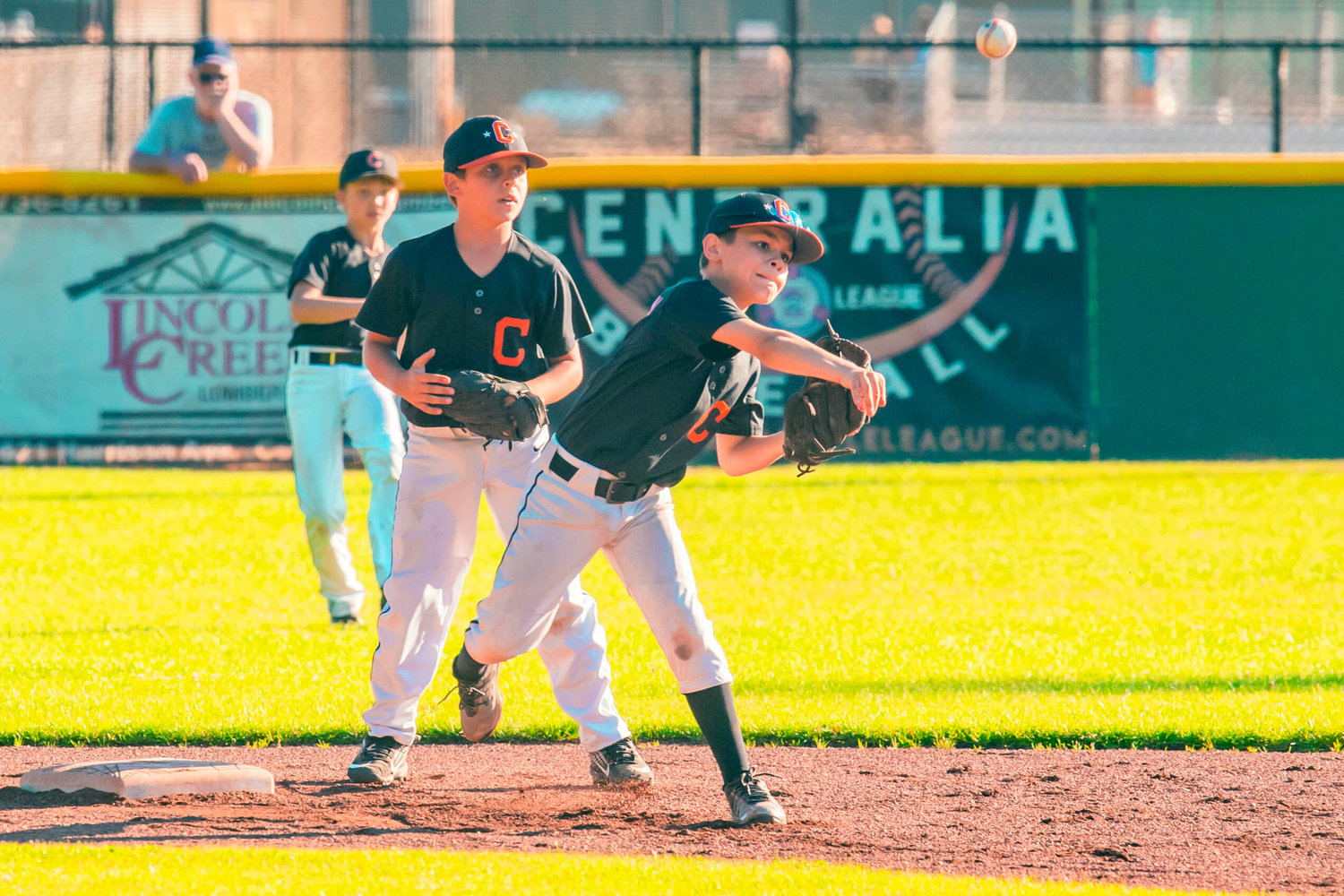 Centralia’s Hank Pennington fields a ball and throws it to first base during the 10U Little League District 3 Championship game against Larch Mountain on Thursday.