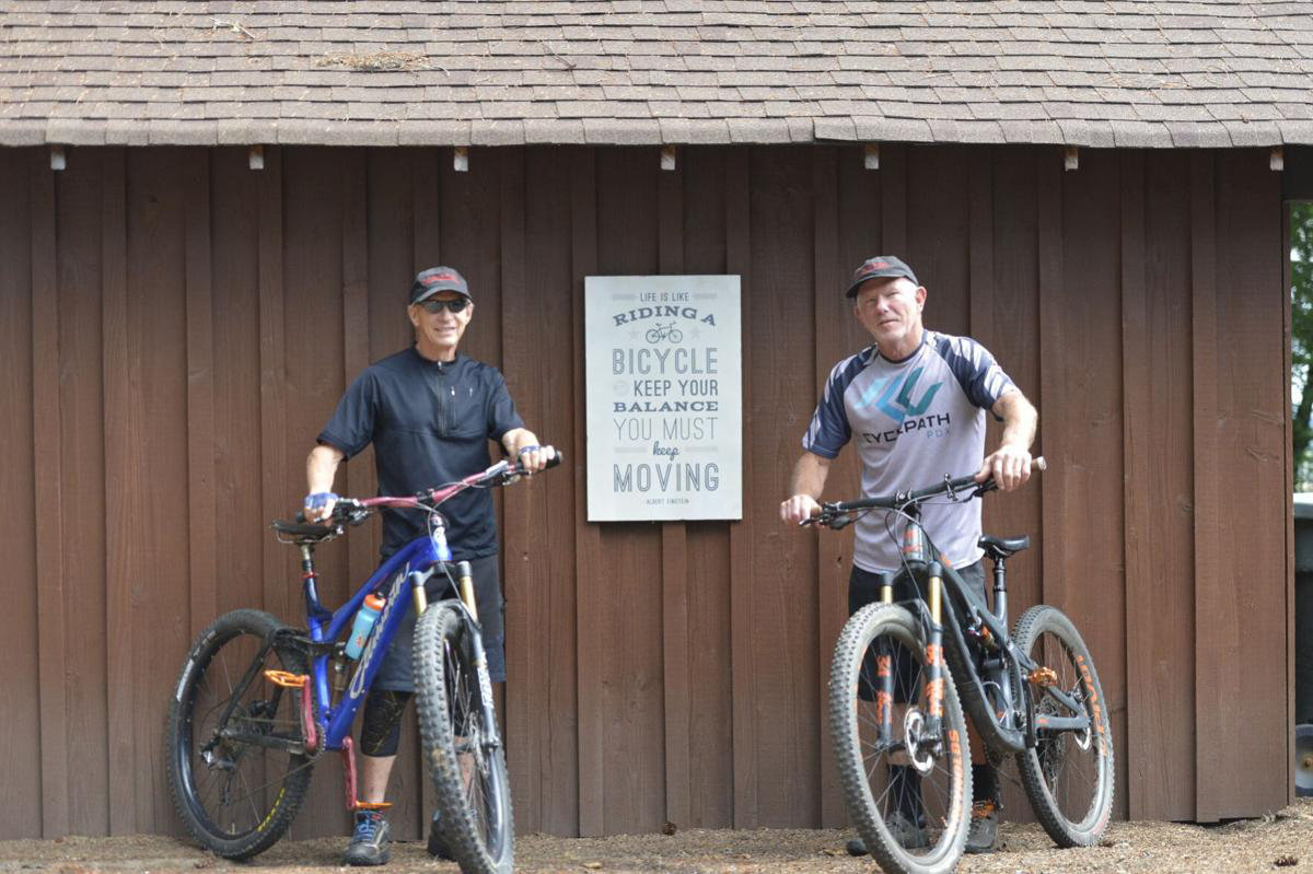 Bob Horness, left, and Jim LeMonds stand with their bikes on LeMonds' property in Castle Rock. The duo, who both turn 71 in August, have been preparing for a 71-mile ride the past two years.