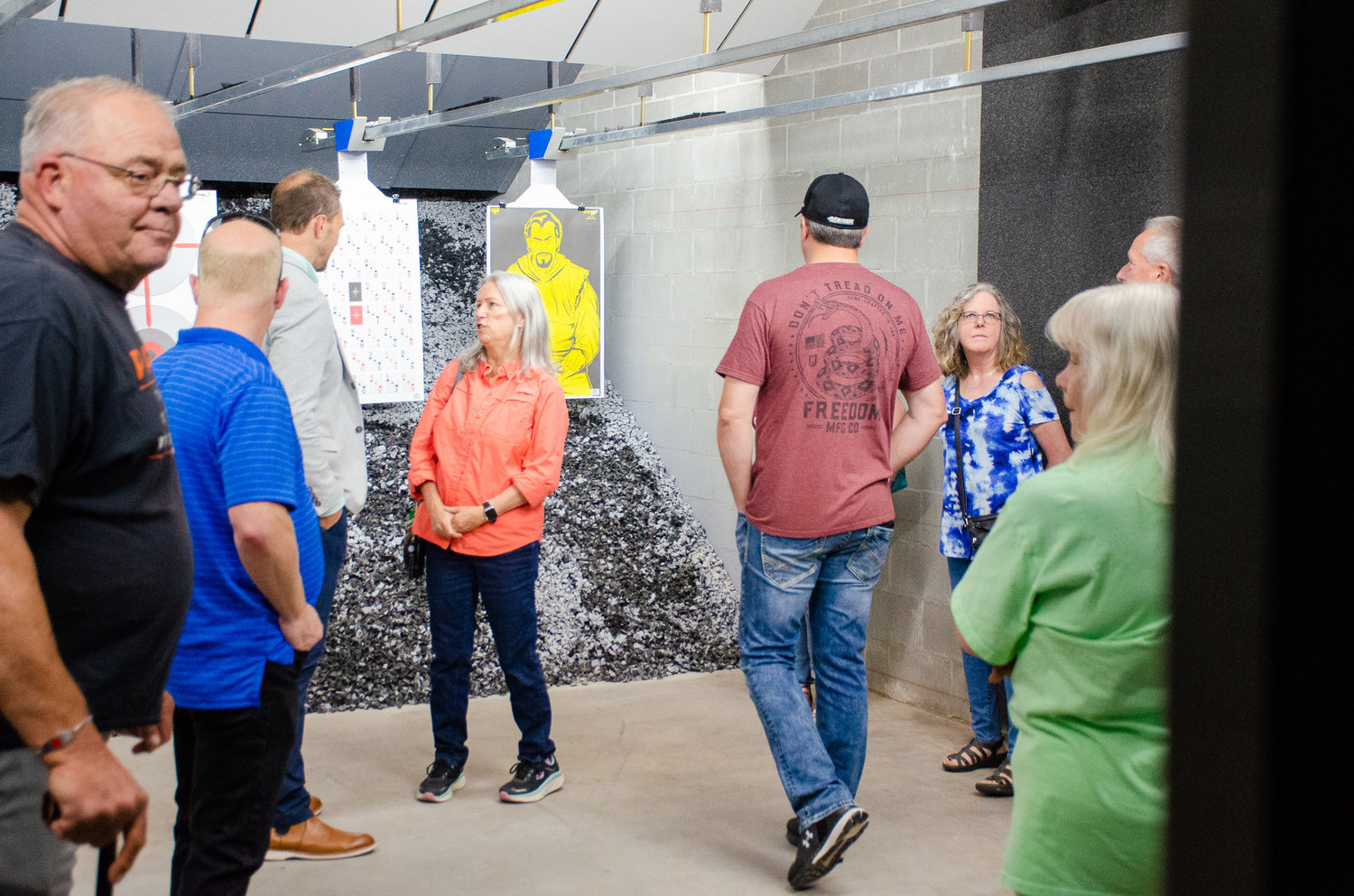 Attendees of a ribbon-cutting ceremony marking the opening of The Man Cave Outfitters new indoor firing range check out the new facility Monday. Construction of the retail expansion was made possible thanks to a quarter-million dollar loan from the Chehalis Tribal Loan Fund.