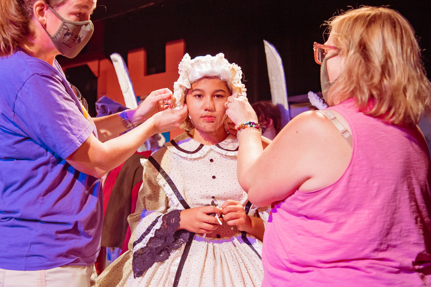 Mia Koong, playing Mrs. Potts, is equipped with a face guard during dress rehearsals for the Beauty and the Beast Musical Tuesday at the Evergreen Playhouse in Centralia.