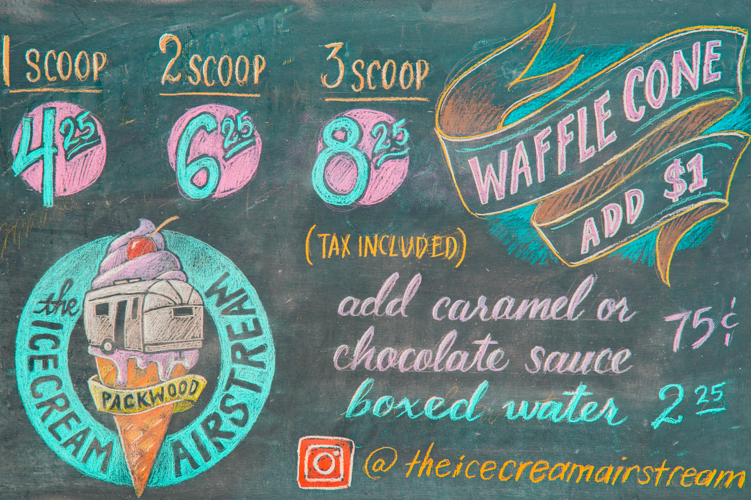 A menu board sits on display, chalked up by local tattooist Grey Francis of Trillium Tattoo, for the Ice Cream Airstream Wednesday in Packwood.