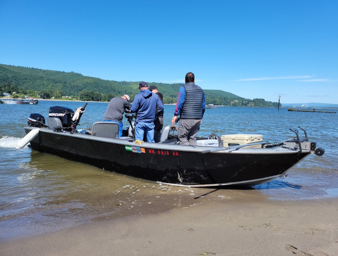 A guide boat sits on the bank of the Columbia River near Kalama, Washington, in June 2021.