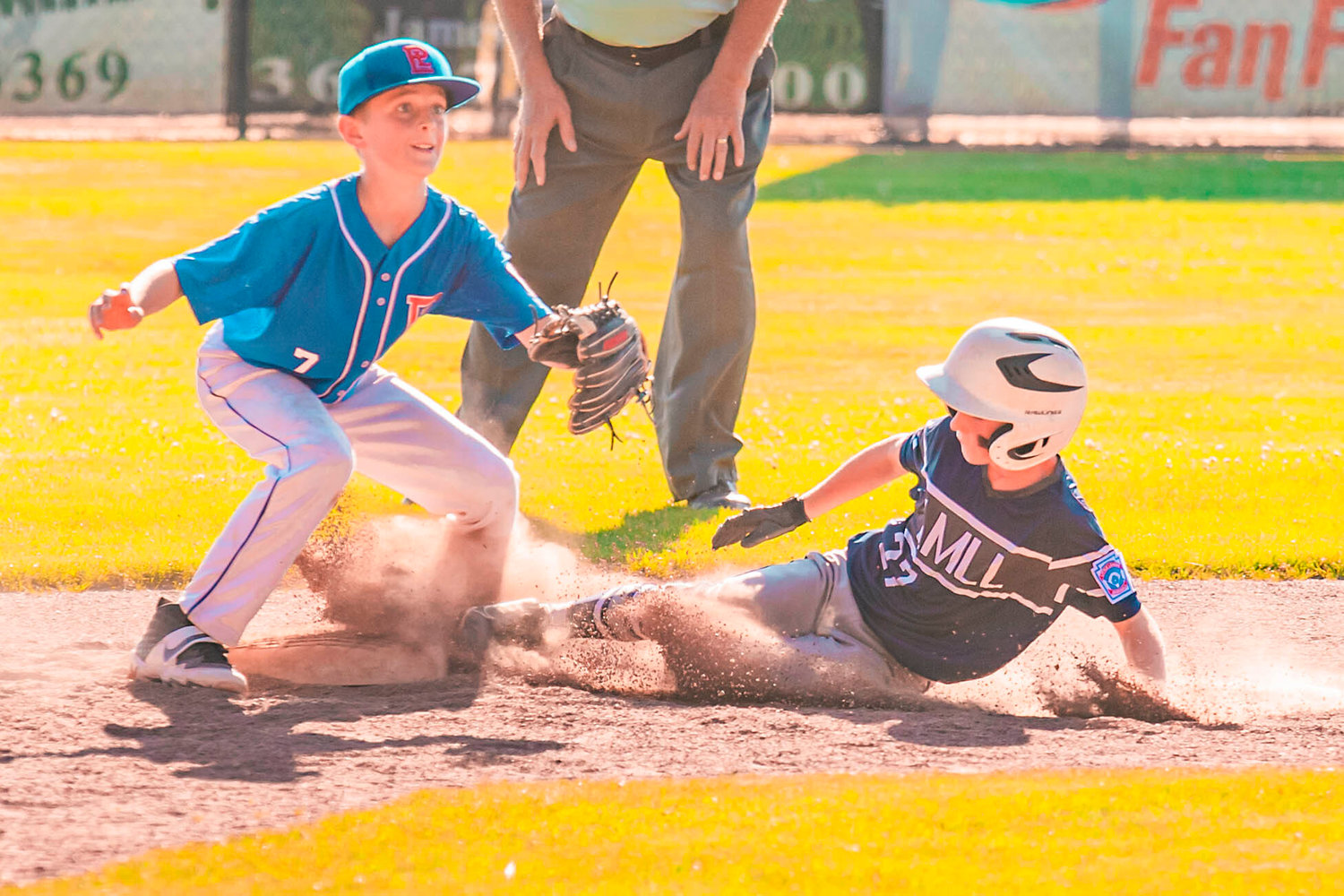 Larch Mountain’s Ryder Radasa (27) slides in safe to second during a game in Centralia at Dick Scott Field on Tuesday.