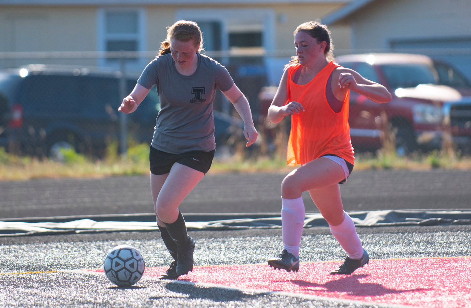 Tenino's Abby Severse, left, battles for possession with a Rochester player during the Battle on the Black Top tournament Thursday in Tenino.
