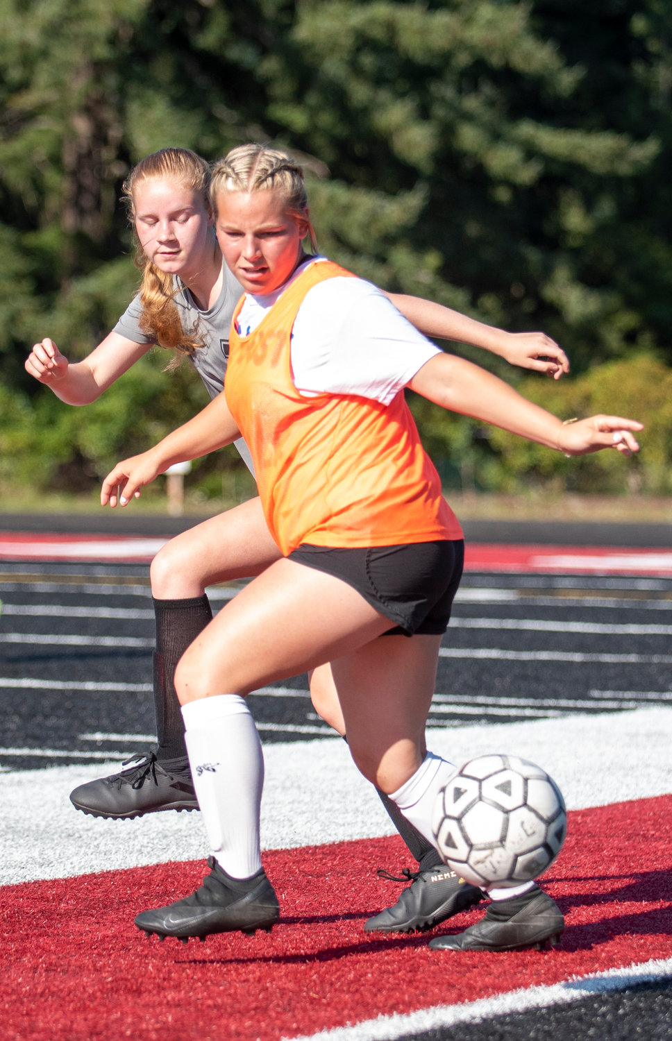 Rochester's Kaylei Clark, front, fights with Tenino's MJ Hallwas for possession on Thursday.