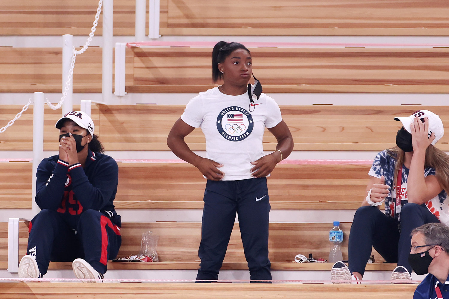 Simone Biles of Team United States watches with teammates Jordan Chiles (left) and Grace McCallum (right) from the stands during the Women's Vault Final on day nine of the Tokyo 2020 Olympic Games at Ariake Gymnastics Centre on Sunday, August 1, 2021 in Tokyo, Japan. (Jamie Squire/Getty Images/TNS)