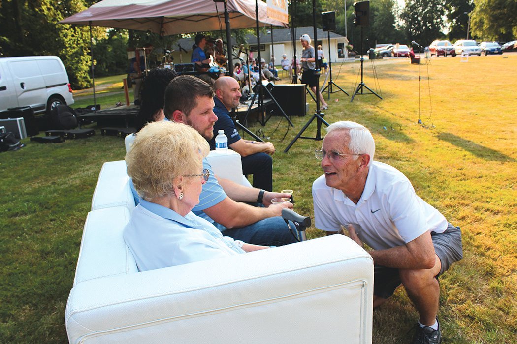 Denny Daniels greets Virginia Lintott and her caregiver, Thad Swanson, at the Chehalis Foundation's Party in the Park fundraiser for Lintott-Alexander Park. Lintott's son, Jim Lintott, made a $25,000 donation in 2004 in honor of his father and her husband, Robert Lintott, that jump-started the Chehalis Foundation's first project, which was to reopen what was historically Alexander Park and was renamed Lintott-Alexander Park.