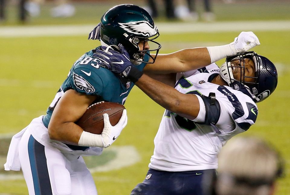 Philadelphia Eagles TE Richard Rodgers (85) hits Seattle Seahawks LB K.J. Wright (50) in the face after catching a pass during the third quarter at Lincoln Financial Field, Monday, Nov. 30, 2020.