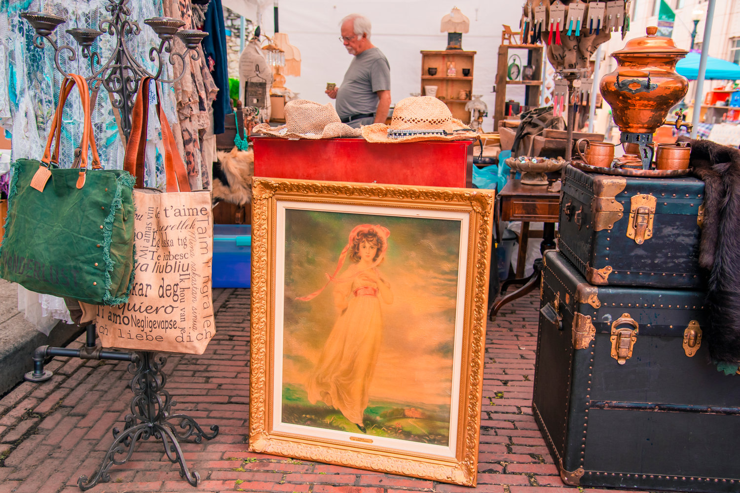 Art sits displayed among other items during Antique Fest in downtown Centralia on Friday.