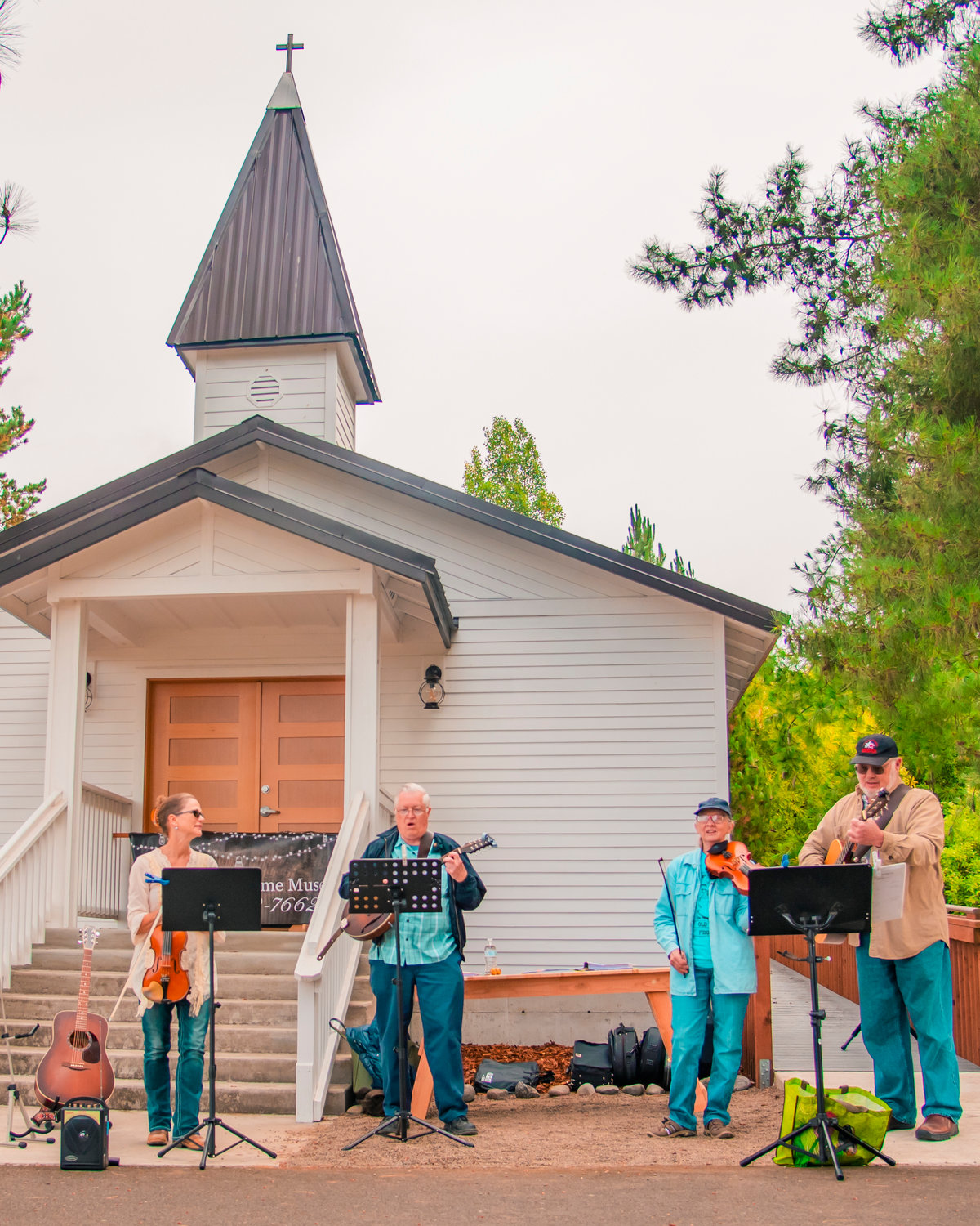 Musicians play instruments outside the Borst Park Pioneer Church in Centralia Saturday morning.