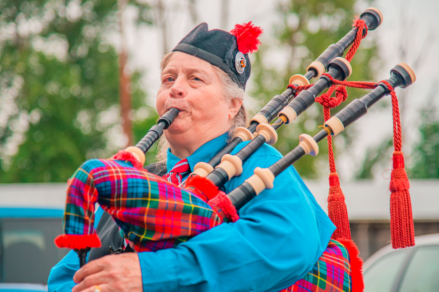 Beverly York plays the bagpipe outside the Borst Park Pioneer Church in Centralia Saturday morning.
