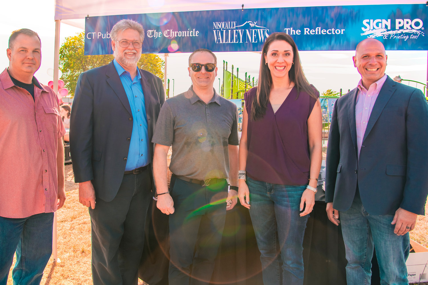 From left, Washington state Sen. John Braun, Rep. Ed Orcutt, Chronicle Publisher Chad Taylor, Congresswoman Jaime Herrera Beutler and state Rep. Peter Abbarno pose for a photo during the grand opening for Penny Playground and the Chehalis Sports Complex on Friday.