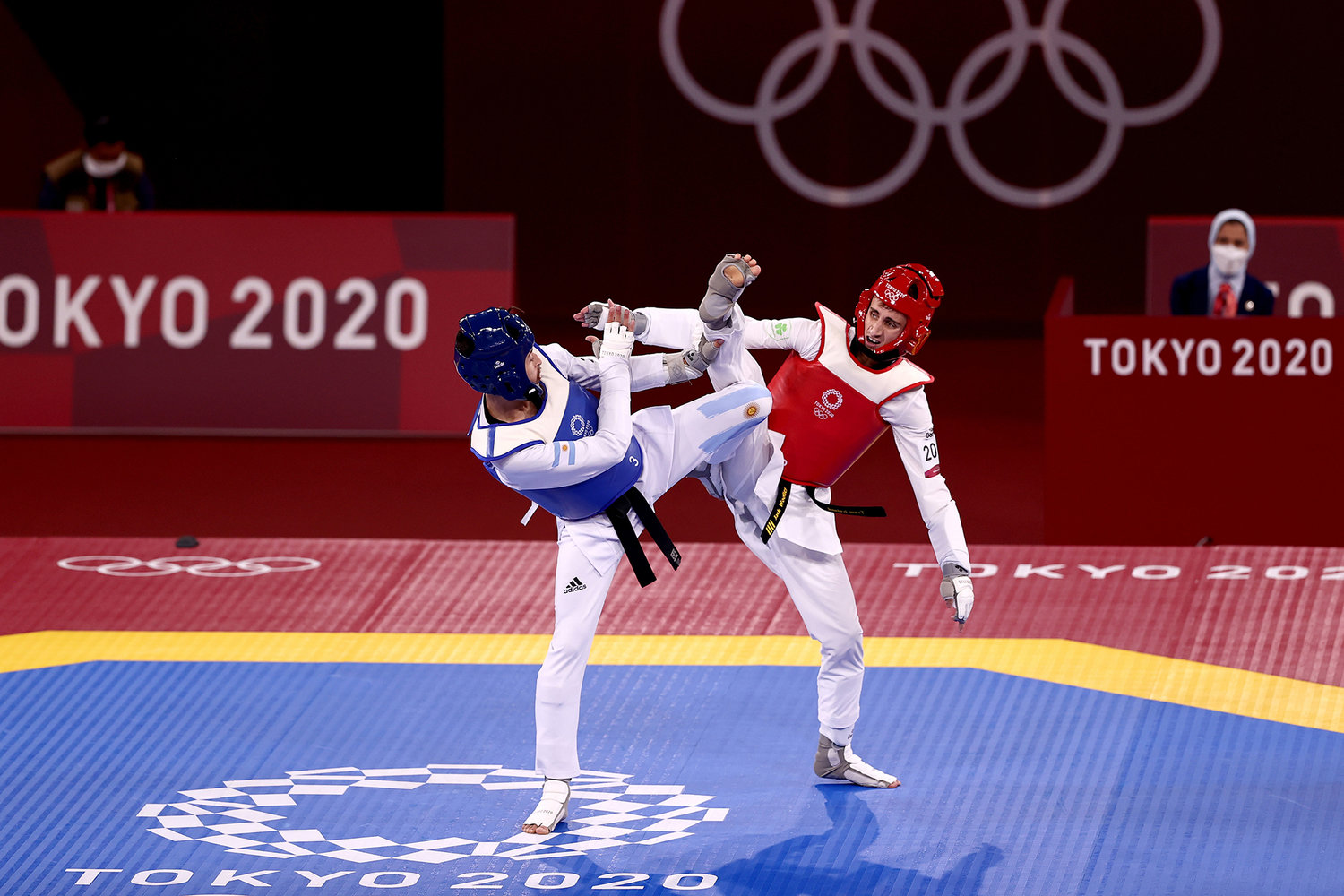 Lucas Lautaro Guzman (L) of Team Argentina competes against Jack Woolley of Team Ireland during the Men's -58kg Taekwondo Round of 16 contest on day one of the Tokyo 2020 Olympic Games at Makuhari Messe Hall on July 24, 2021 in Chiba, Japan.