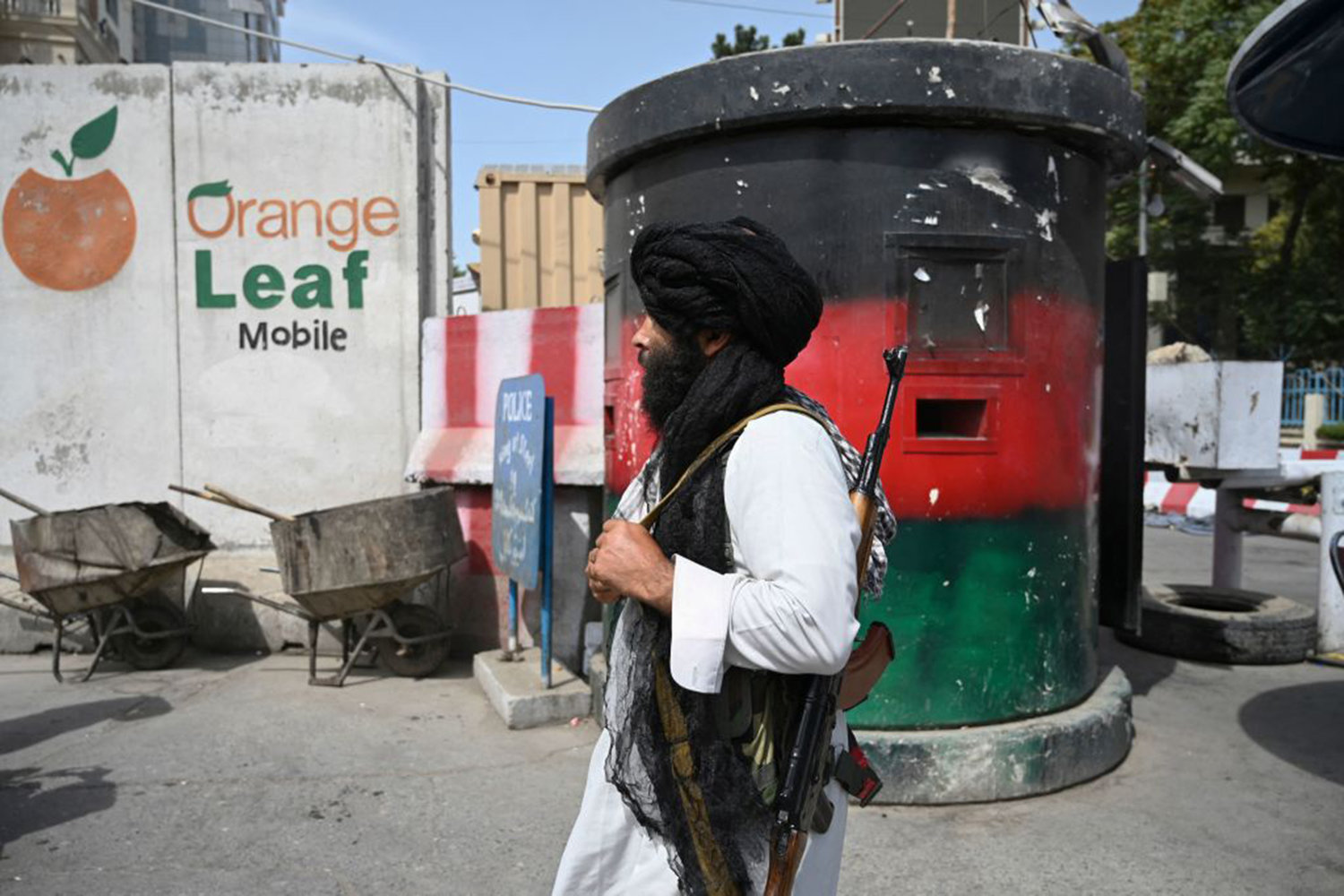 A Taliban fighter patrols along a street in Kabul on August 17, 2021, as the Taliban moved quickly to restart the Afghan capital following their stunning takeover of Kabul and told government staff to return to work. (Wakil Kohsar/AFP via Getty Images/TNS)