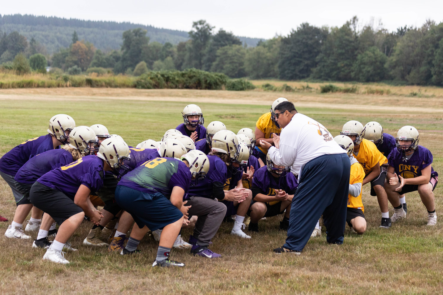 Onalaska head coach Mazen Saade gets his team ready to start its first practice of the fall ahead of the 2021 football season Wednesday morning.