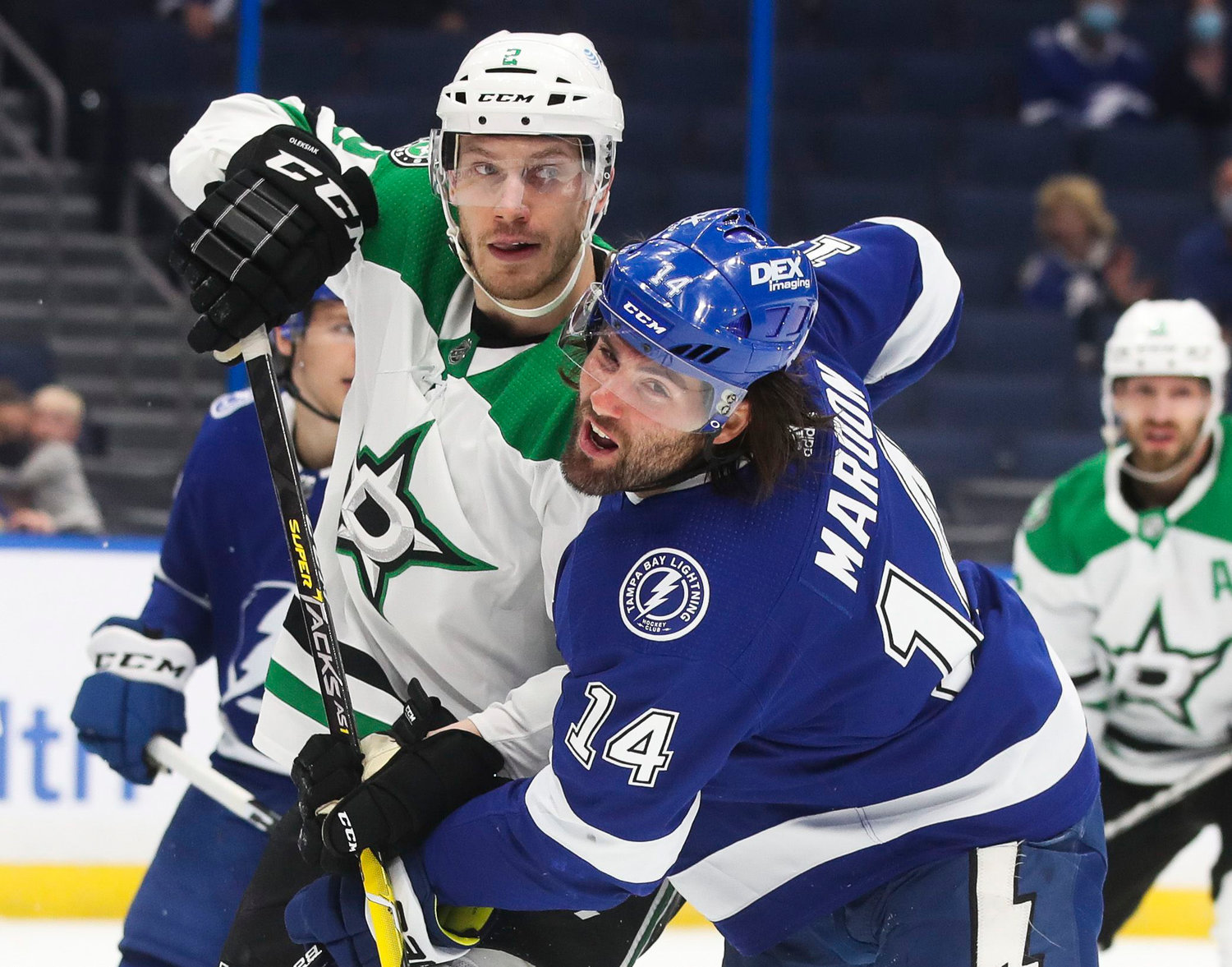 Tampa Bay Lightning left wing Pat Maroon (14) battles Dallas Stars defenseman Jamie Oleksiak (2) for positioning in front of the net during first period action at Amalie Arena on May 5, 2021 in Tampa.