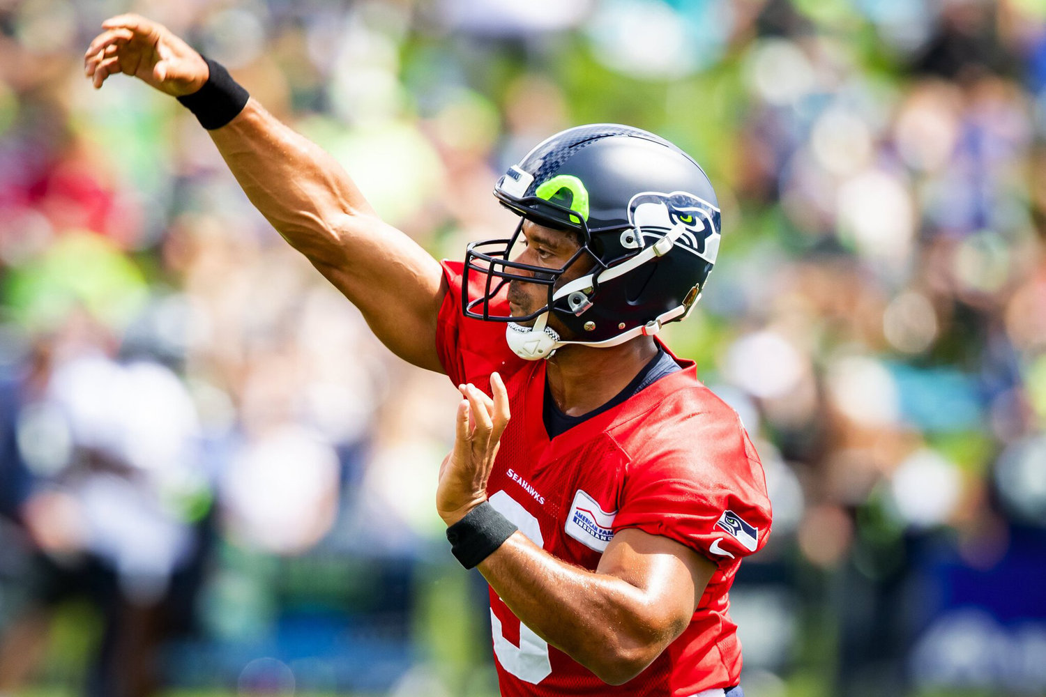 Russell Wilson makes a throw during Seahawks Training Camp at the Virginia Mason Athletic Center in Renton, Aug. 6, 2021.