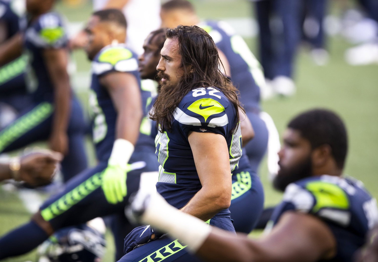 Tight end Luke Willson stretches in warmups before a game against the New England Patriots in Seattle, Sept. 20, 2020.