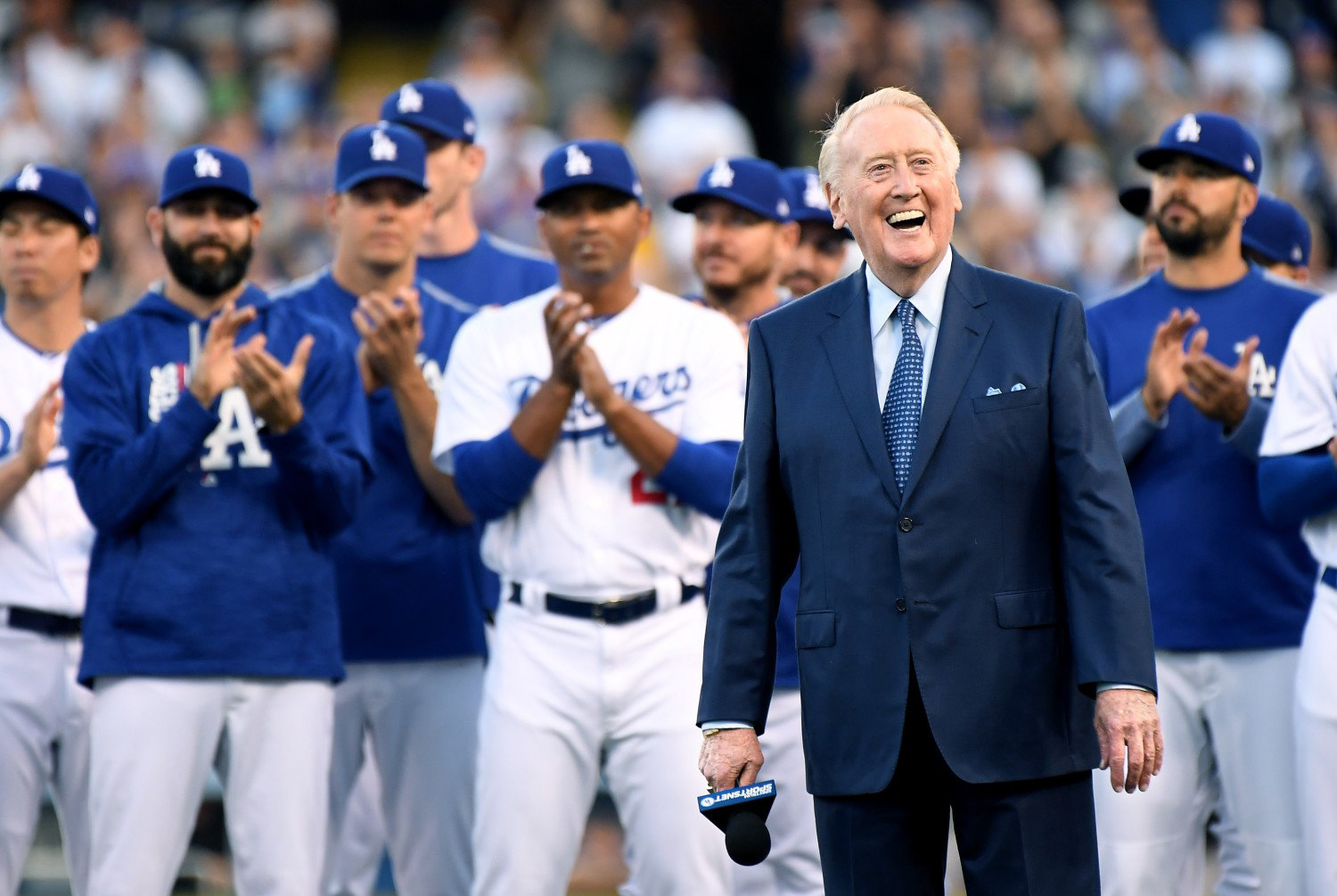 Vin Scully is all smiles as the former broadcaster is inducted into the Ring of Honor at Dodger Stadium Wednesday. (Wally Skalij/Los Angeles Times)