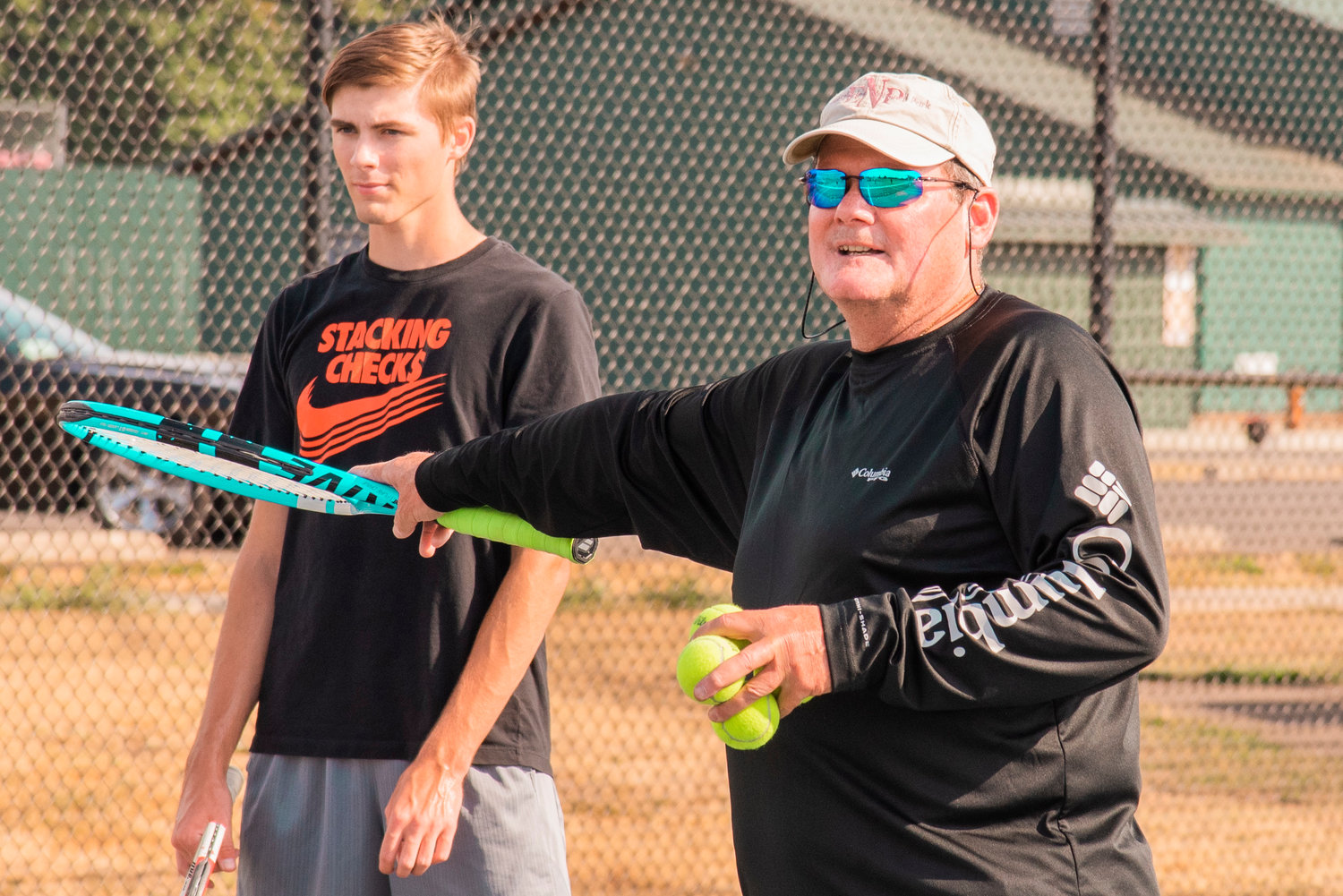 Centralia Tennis Coach Scott Snyder points towards Landon Kaut while talking to players during practice near Tiger Stadium in Centralia on Tuesday.