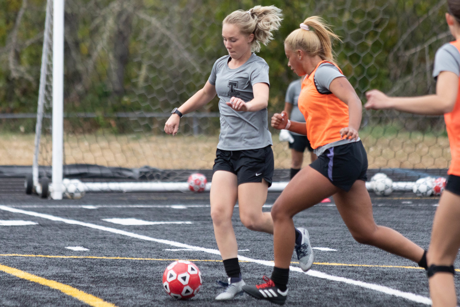 Senior Megan Letts (left) is defended by Alivia Hunter (right) during Tenino's practice Monday afternoon.
