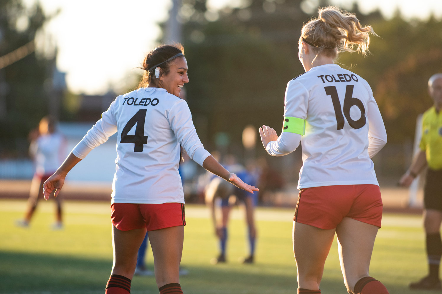 Toledo's Briza Gallegos (4) high-fives teammate Greenlee Clark (16) after scoring a goal against Toutle Lake in a jamboree Thursday. Clark assisted the goal.