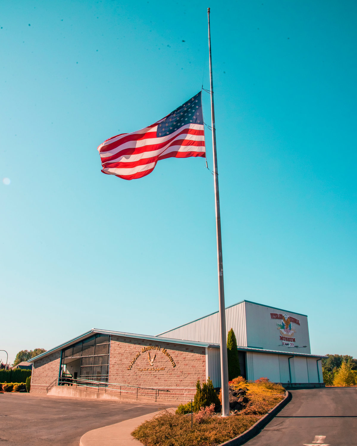 A half staff American Flag waves above the Veterans Memorial Museum in honor of the U.S. service members and other victims killed in the terrorist attack on August 26, 2021, in Kabul, Afghanistan.