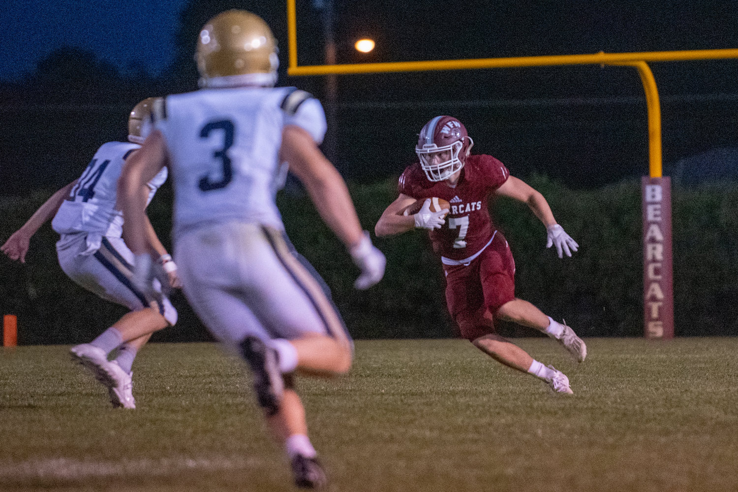 W.F. West tailback Brock Guyette looks for open space against two Kelso defenders on Friday, Sept. 3.