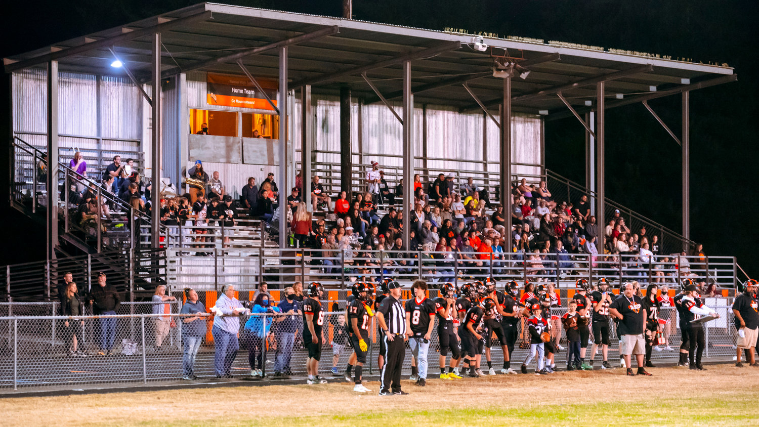 Fans fill the stands at Rainier High School as the Mountaineers face off against Toledo Friday night.