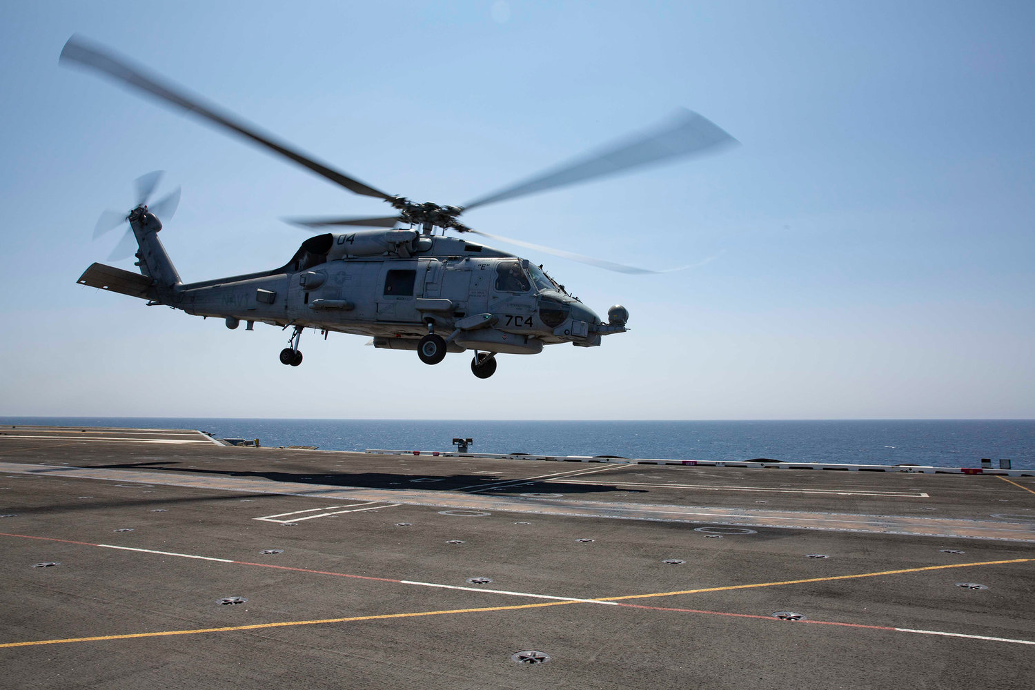 An MH-60R Sea Hawk helicopter, assigned to the "Raptors" of Helicopter Maritime Strike Squadron (HSM) 71, takes off of the flight deck of the aircraft carrier USS Abraham Lincoln. A similar Navy helicopter operating from the ship crashed off the coast of San Diego on Aug. 31, 2021. (Petty Officer 2nd Class Amber Smalley/U.S. Navy/TNS)