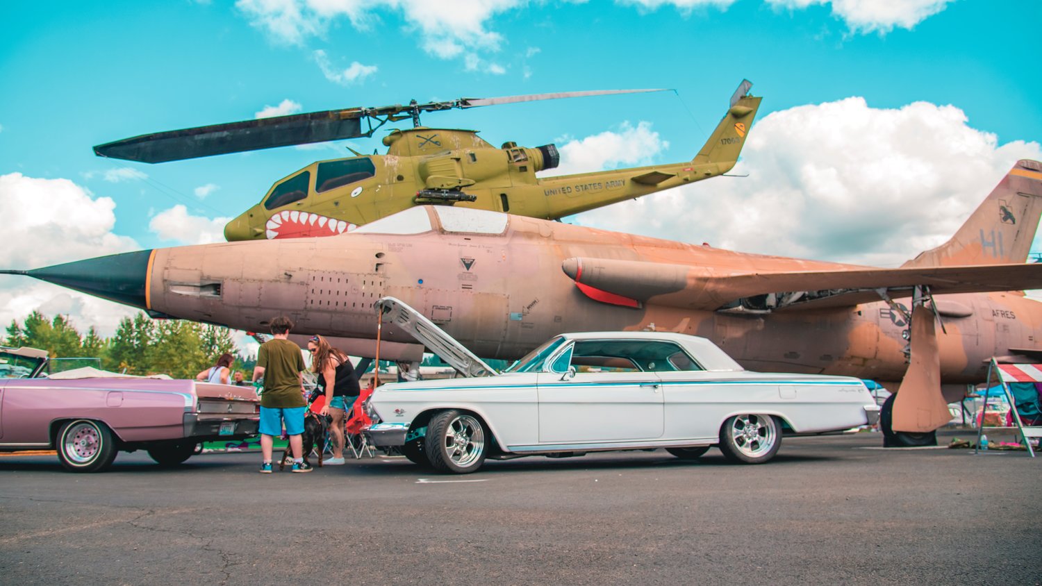 Vintage vehicles and military aircraft are displayed outside the Veterans Memorial Museum on Sunday for the Rust or Shine Car Show and Music Festival in Chehalis.