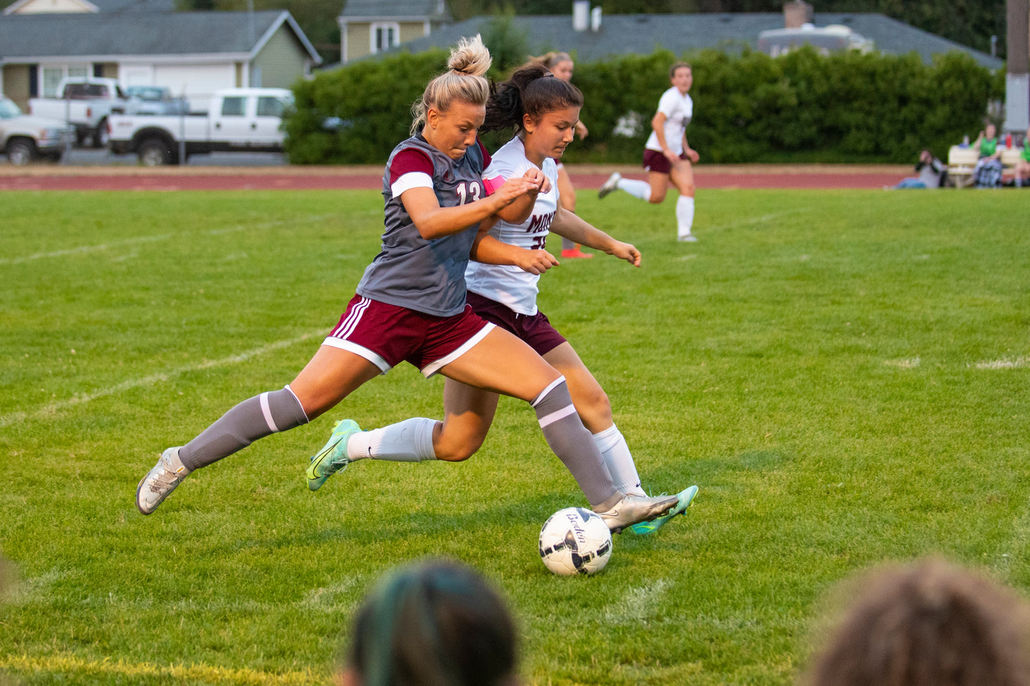 FILE PHOTO -- W.F. West junior midfielder Cam Sheets (13) battles with a Montesano player for possession during a non-league match at home on Tuesday.